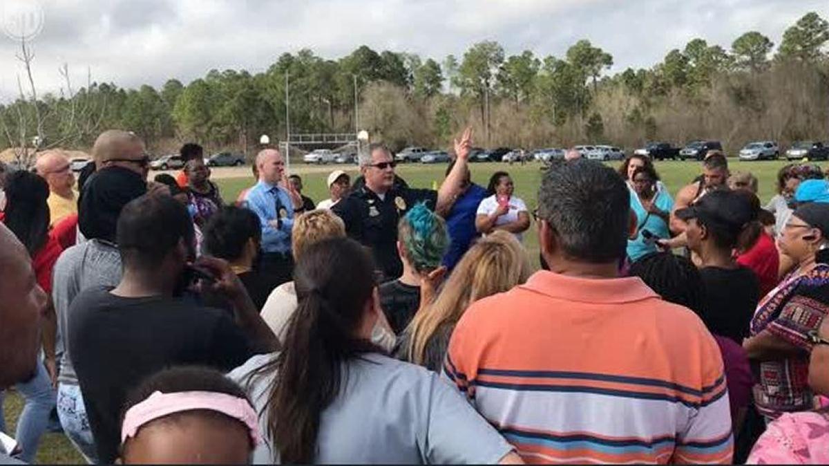 Gulfport Police Chief Leonard Papania talks to parents who gathered outside North Gulfport Middle School on Thursday, February 22, 2018. The school was placed on lockdown after a report of gunfire at the school. There was no evidence of a gun on campus.