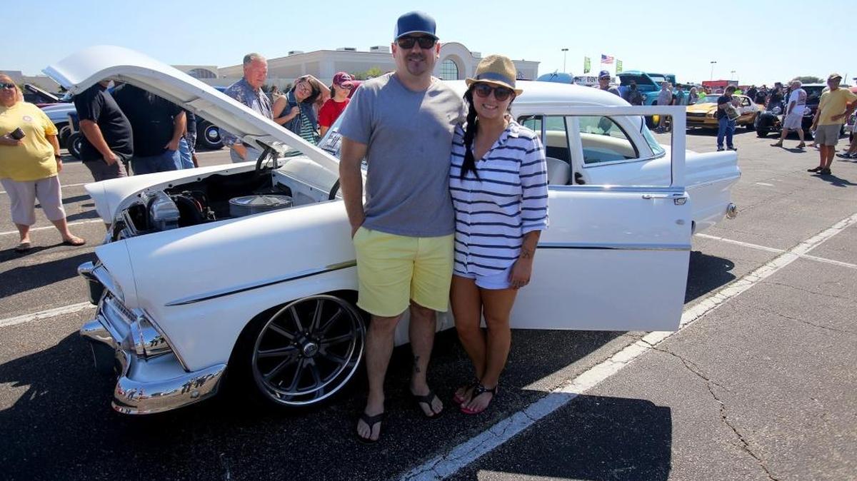 Belle Chasse residents Jacob and Jessica Williams pause in front of their 1955 Ford Customline Victoria two-door on Saturday, October 8, 2016. It was restored and customized by the guys at Gas Monkey Garage and sold to Dallas Mavericks owner and ‘Shark Tank’ host Mark Cuban. Williams bought it and made some modifications, including lowering it and putting rims on.