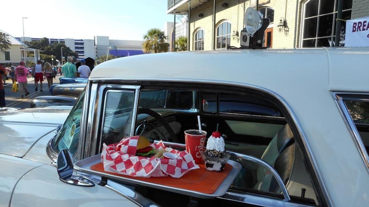 Besides the cars, there’s always plenty to see at Cruisin’ The Coast, like this drive-in set-up on a car in downtown Biloxi.