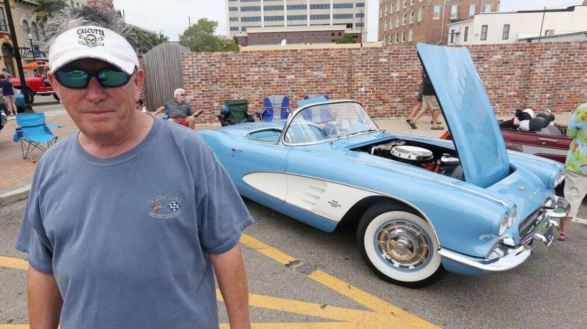 Michael Mardellus of Biloxi poses with his 1961 Chevrolet Corvette during Gulfport’s View the Cruise event in downtown Gulfport on the first day of Cruisin’ The Coast, Sunday, Oct. 2, 2016.