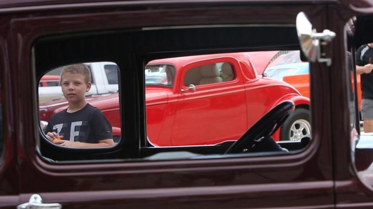 Zachary Henderson, 9, of Pass Christian looks through the window of a 1930 Model A on display at Gulfport’s View the Cruise event on the first day of Cruisin’ The Coast, Sunday, Oct. 2, 2016.