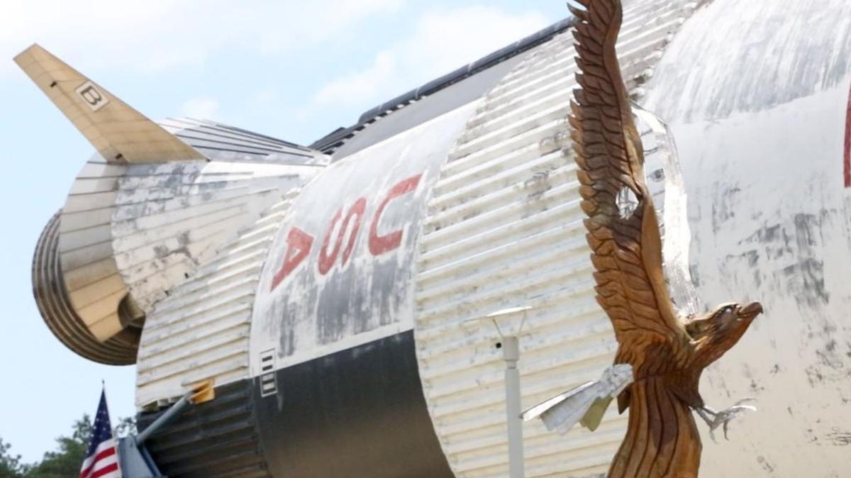 Marlin Miller's eagle sculpture soars near the Saturn V rocket booster at Infinity Science Center in Hancock County on Tuesday June 21, 2016. The rocket now is on the west side of Infinity and is the first thing many drivers see when arriving in Mississippi.