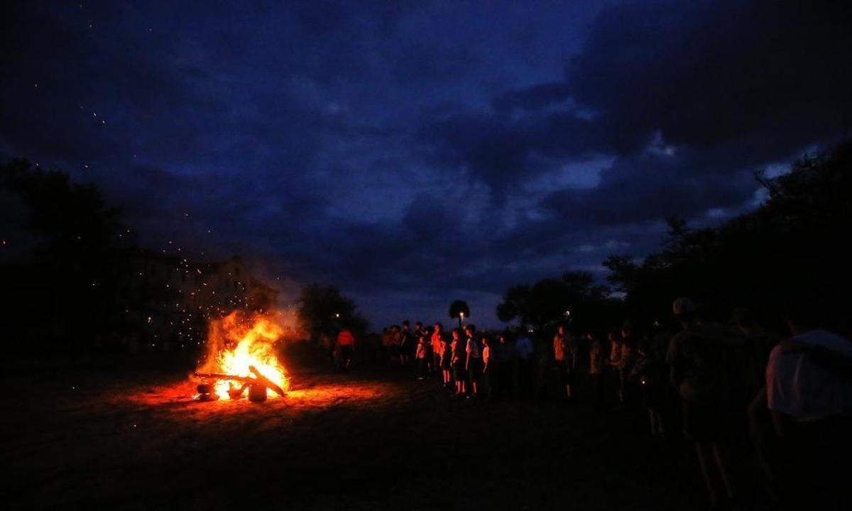 Boy Scouts gather to participate in the Mississippi Band of Choctaw Indians Cub Scouts Pack 61’s final dance on Saturday, March 18, 2017, at Centennial Plaza in Gulfport. The group taught about their cultural dances. Photographer’s comments: I love the color of this photographer — the warm red tones of the fire contrasted by the deep blue of the night sky.