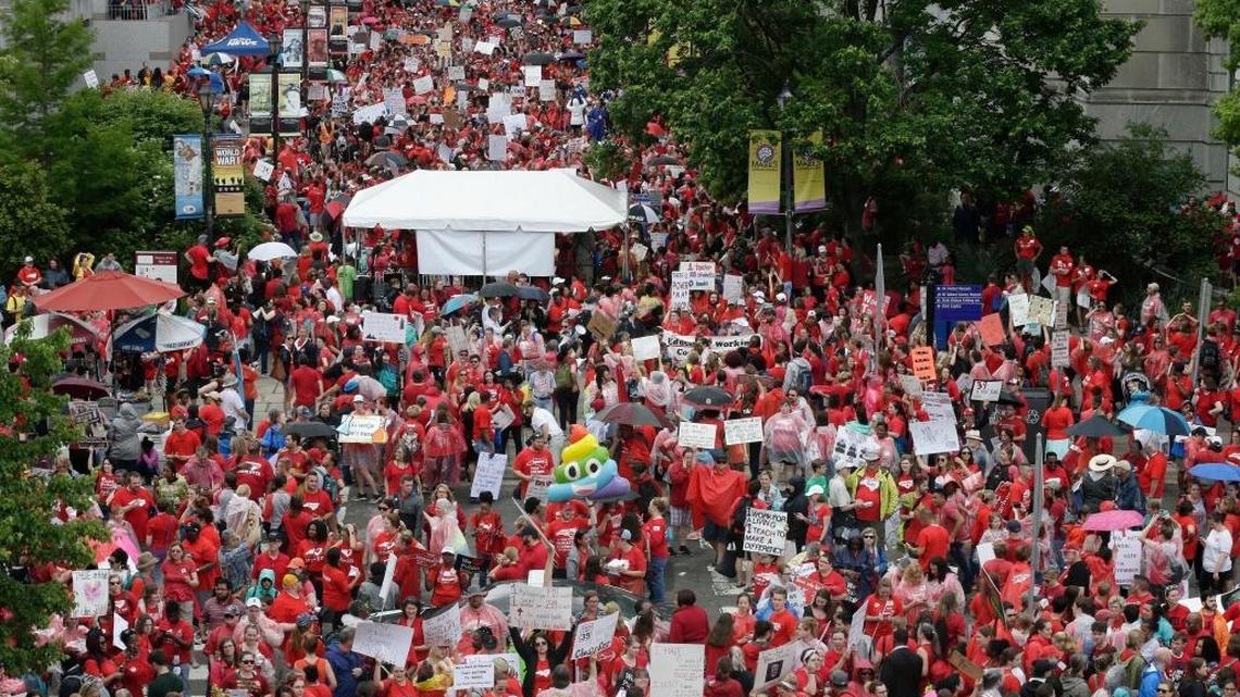 Educators fill Bicentennial Plaza during a teachers rally at the General Assembly in Raleigh, N.C., Wednesday, May 16, 2018. Thousands of teachers rallied the state capital seeking a political showdown over wages and funding for public school classrooms.
