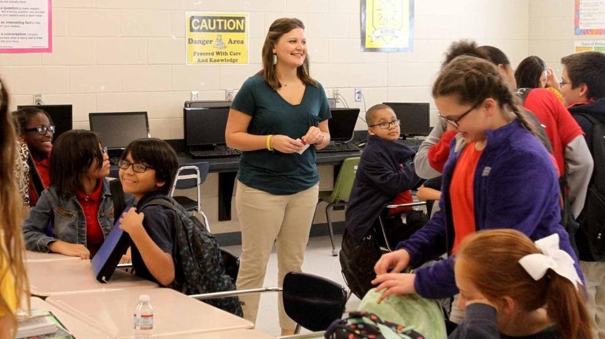 Jessica Whittington jokes with her students as they prepare to change classes at Singing River Elementary. The Pascagoula-Gautier School District had the highest average teacher salary — $48,926 — of any district in the state in 2014-15.