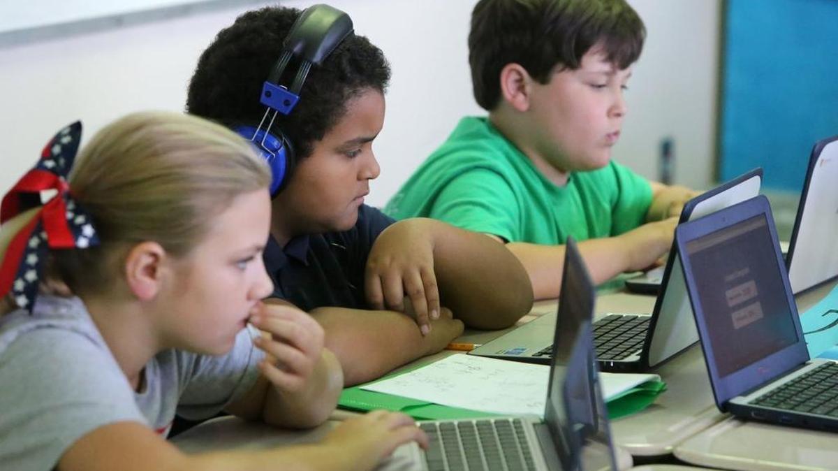 Trent Lott Middle School fifth-graders Chelsea Rogers, from left, Shane Bardwell and Ethan Bardwell work on their Chromebooks in a math class at the Pascagoula school on Wednesday, Oct. 19, 2016. Access to technology has helped the Pascagoula-Gautier district do well in state testing measurements.