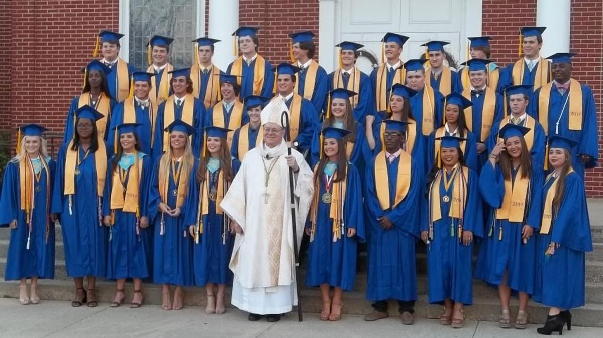 The 2017 graduates of Resurrection Catholic High School with Bishop Louis Kihneman