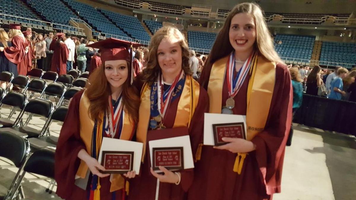East Central High SchoolValedictorian Sarah Eyre, center, flanked by Salutatorian Katlyn Scott, left. and Historian Emily Byars.