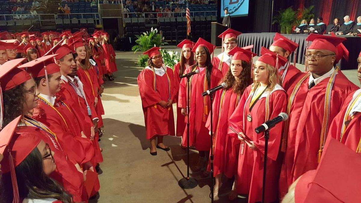 Graduating members of the Biloxi High School choir sings the alma mater to wrap up their graduation ceremony.