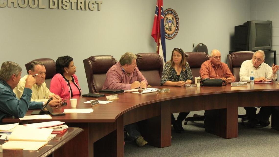 Harrison County School Board members work Monday during their regular meeting. They met with a woman in a closed session, where she said her son, a West Harrison High School student, had been forced to stand during the Pledge of Allegiance. She said he was threatened with punishment when he refused.