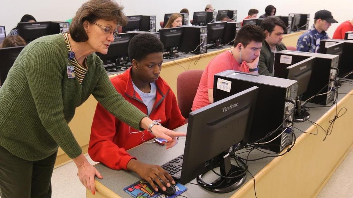 Mississippi Gulf Coast Community College instructor Margaret West helps Derek Watts in his computer application class March 3. MGCCC and Pearl River Community College are likely to lose millions of dollars in state funding for the upcoming school year.