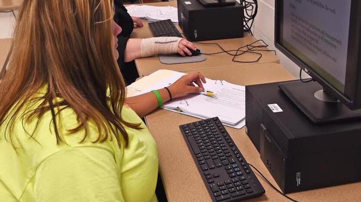 Summer Denning, 18, of Silver Run, at front, and Mikayla Crawford, 18, of Ramsey Springs, work on computer training that will help them prepare for the high school equivalency test and future careers. Both are participating in the WIOA Youth Out-of-School Program in Stone County that is provided at no cost to eligible participants through a grant from the Southern Mississippi Planning & Development District and the Twin Districts Workforce Development Area.