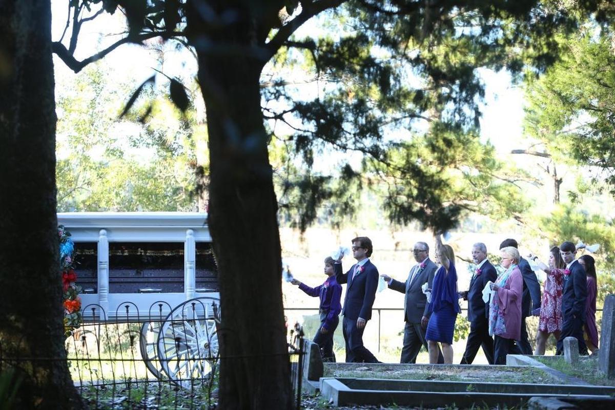 Josh and Angel Myers, along with their families, secondline to the gravesite of the Myers’ daughter, Sophia, who died Oct. 20 after battling a rare brain tumor called DIPG. Sophia’s casket was pink and bedazzled by family and friends. Photographer’s comment: This photo from Sophia Myers’ burial was hard for me to take. A family is trying to celebrate a young child’s life with a secondline to her mausoleum, but the grief still stings, and you can see on their faces.