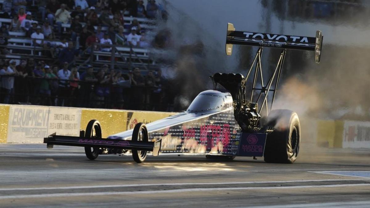 A top-fuel dragster makes a pass down a drag-race track. Wednesday nights, Milan Dragway’s King of the Hill offers time trials and elimination rounds of all kinds of drag racers.