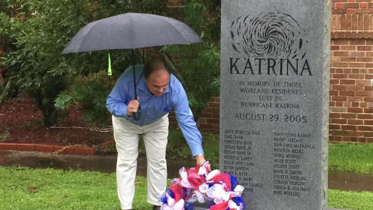 Waveland Alderman Charlie Piazza places a wreath on a Hurricane Katrina memorial in Waveland on Tuesday.