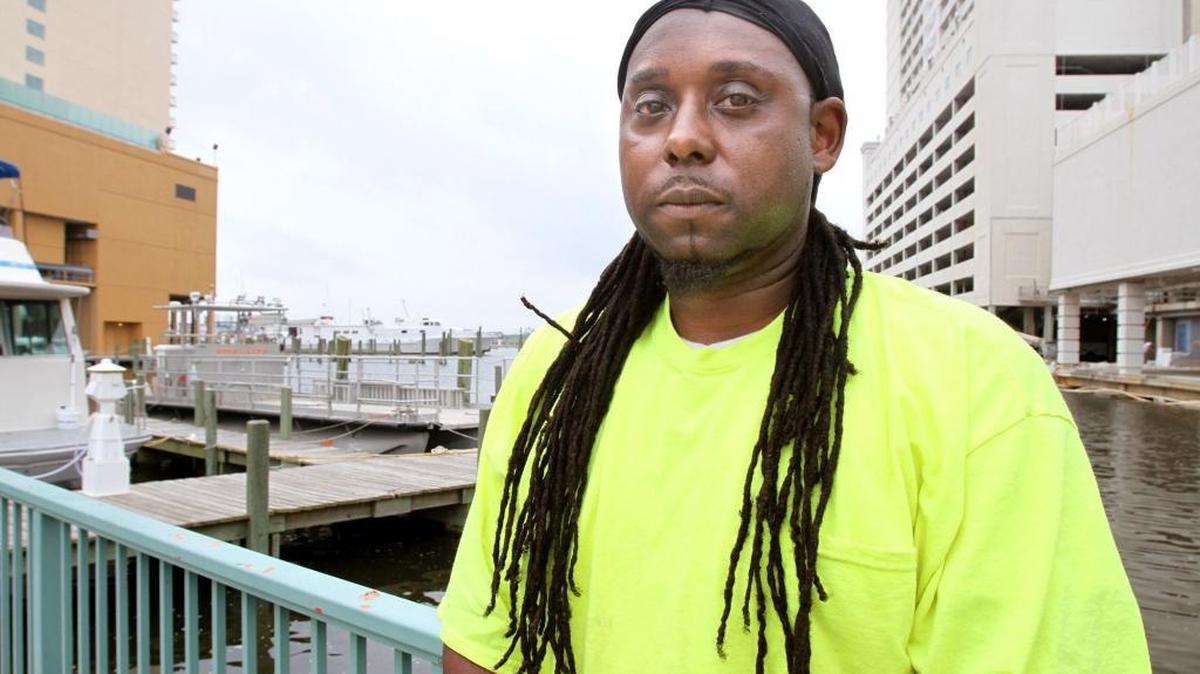 Larry Christmas Jr., pictured in April, is suing Gulfport because he says that he was denied a firefighter’s job for refusing to cut off his dreadlocks.