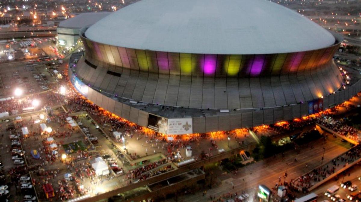 In this Jan. 7, 2008, file photo, color lights play on the Louisiana Superdome at twilight before the BCS championship college football game in New Orleans. The BYU-LSU game will be played Saturday, Sept. 2, 2017 at the Superdome in New Orleans after massive flooding in Houston from Hurricane Harvey forced it to be relocated from NRG Stadium.