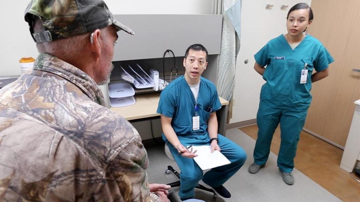 Medical personnel at Keesler Medical Center in Biloxi meet with a patient in October 2017.