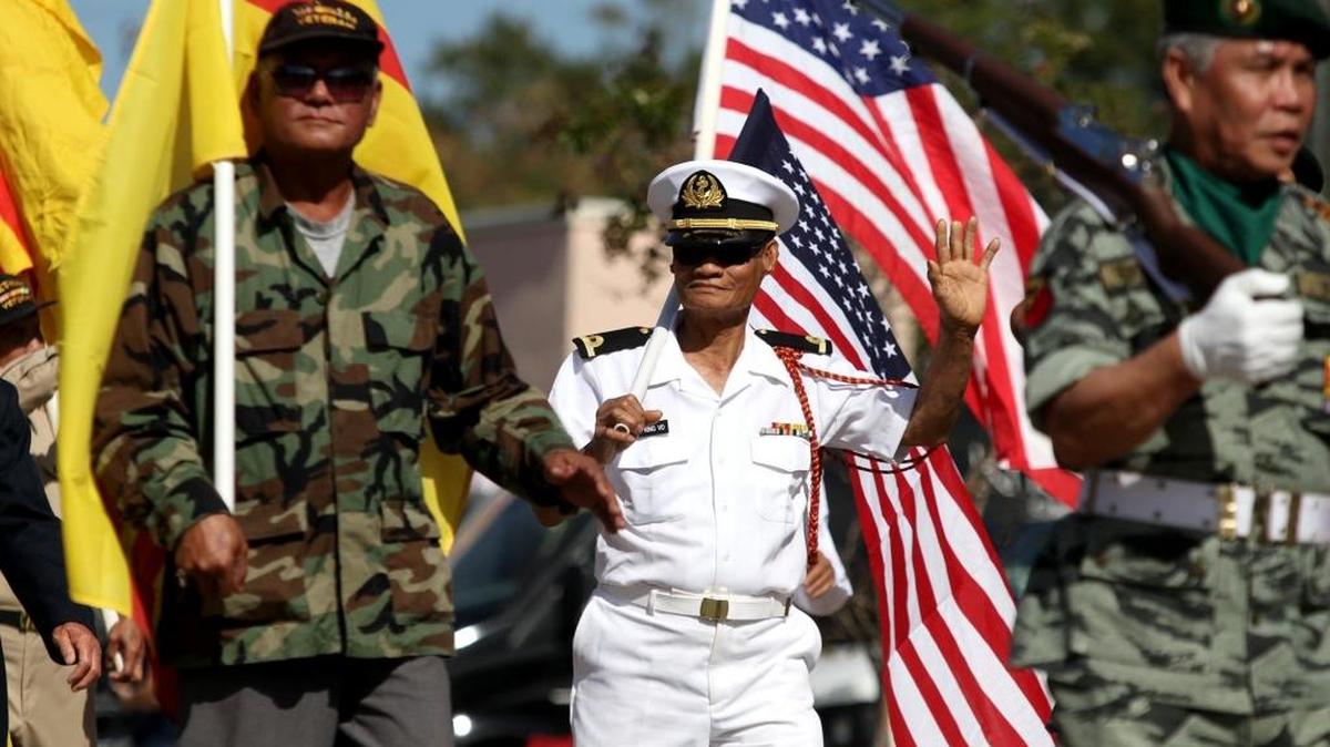 Vietnamese veterans walk in the Veterans Day parade in D'Iberville on Saturday, November 12, 2016.