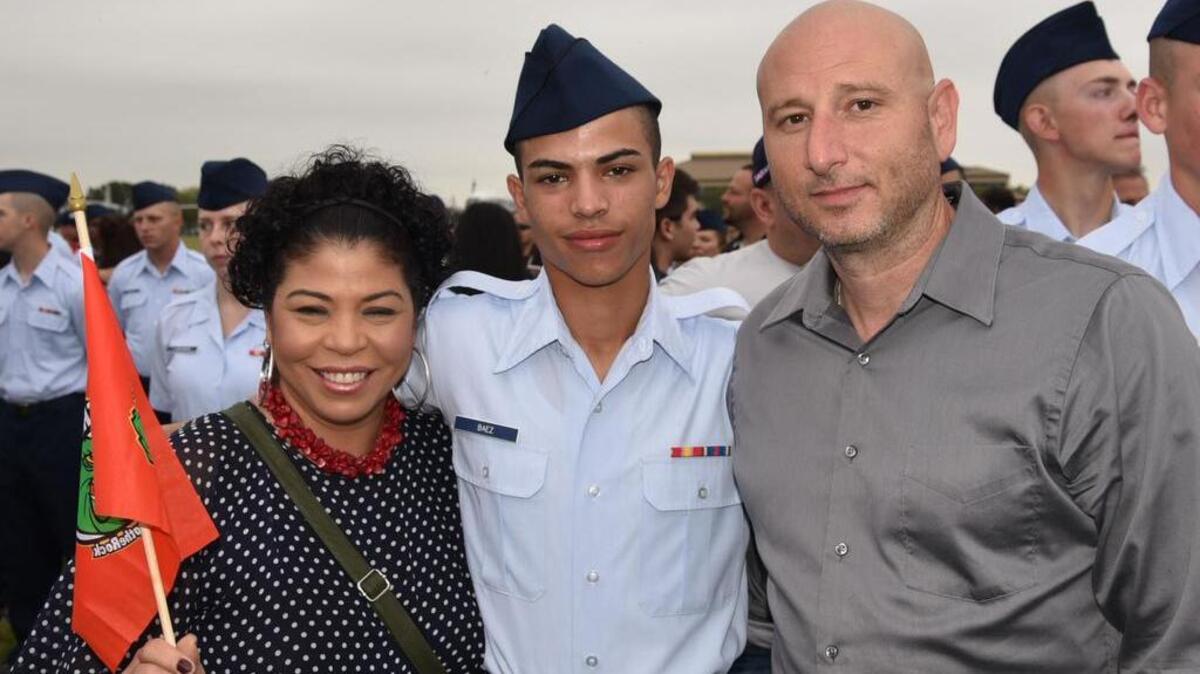 Airman George Baez, center, is shown with his mother, Elizabeth Torres, of Bridgeport, Connecticut, left, and Ret. Air Force Master Sgt. Jeffrey Thatcher, right, of Biloxi, after Baez's graduation from basic training at Lackland Air Force Base in San Antonio.
