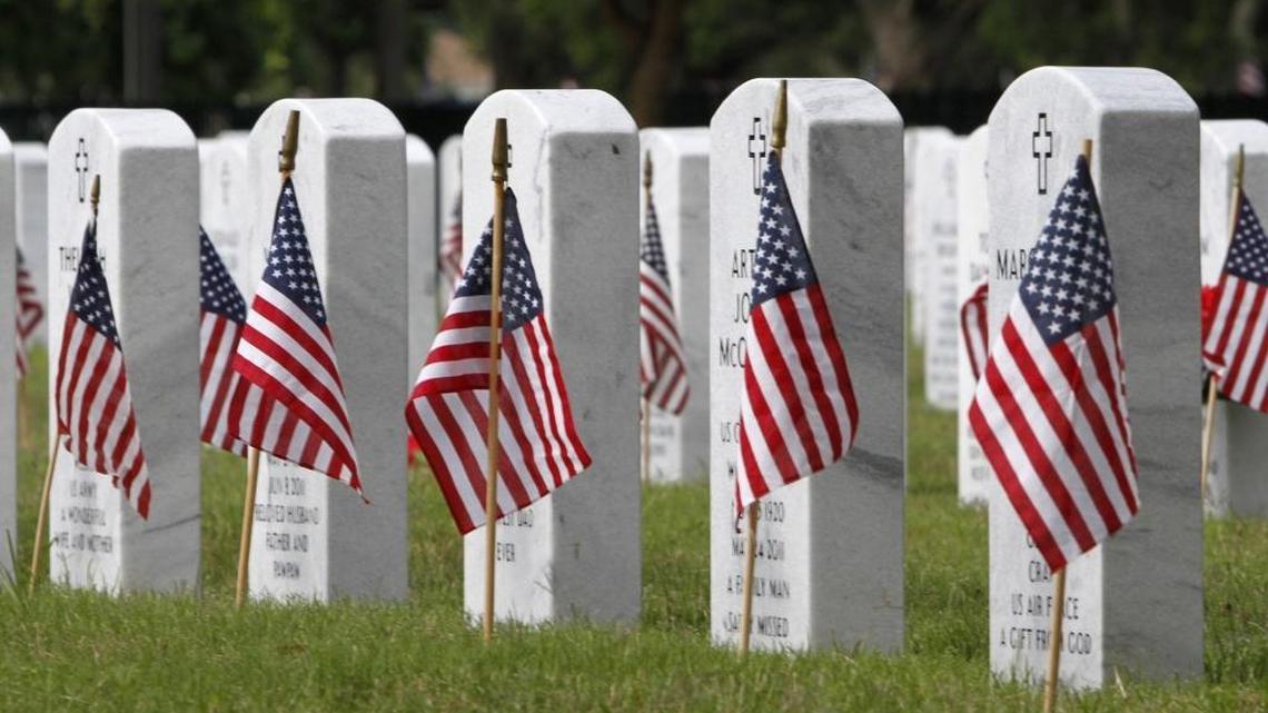 Help place flags at Biloxi National Cemetery on Saturday