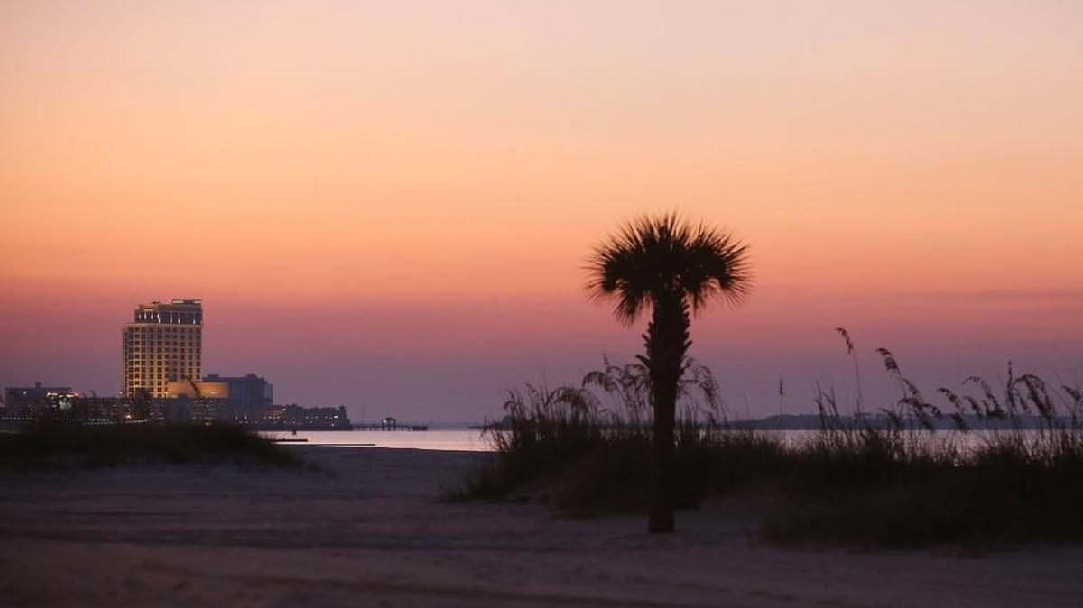 Sunrise near Casino Row in Biloxi shows two of the strengths of the Mississippi Gulf Coast. Developers from other cities don’t have a waterfront or casinos on which to build, say Coast business executives, or a new plan and money to fund big ideas. 