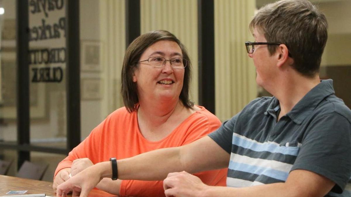 Deborah Watkins, left, and Anita Twiner of Long Beach apply for a marriage license at the Harrison County Courthouse in Gulfport on June 29, 2015.