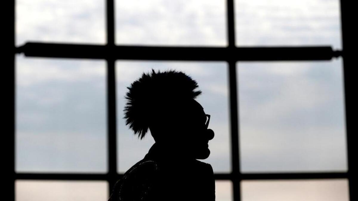 A clown with the Ringling Bros. and Barnum & Bailey Circus, is silhouetted in 2014, in Newark, N.J.