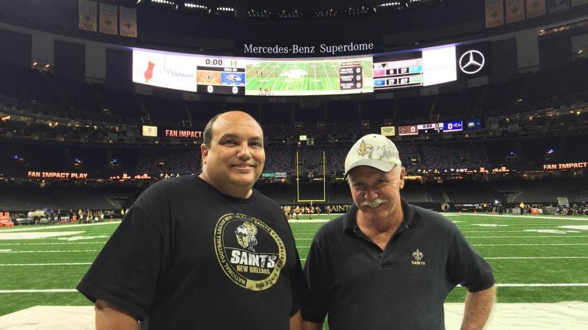 Marvin Clifford and David Clifford get on the field before the Thursday, Sept. 1, 2016 New Orleans Saints football game in the Mercedes-Benz Superdome.