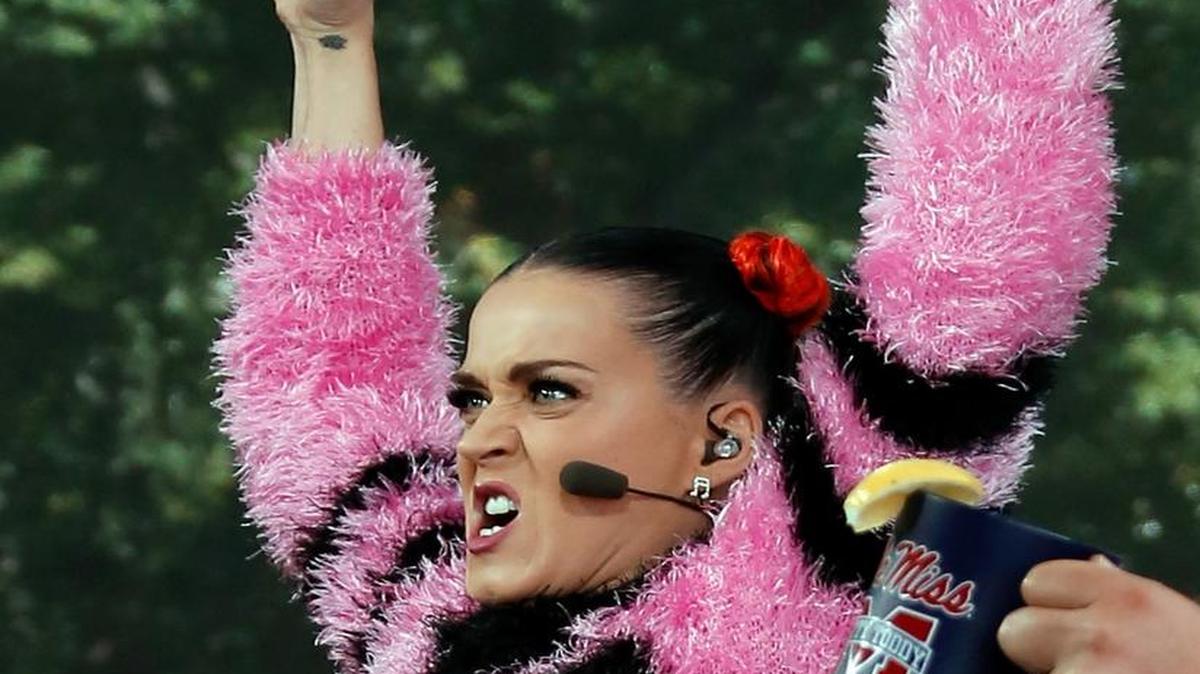 Singer Katy Perry cheers for Ole Miss during a telecast of ESPN's College GameDay in The Grove at the University of Mississippi prior to an NCAA college football game against Alabama in Oxford on Saturday, Oct. 4, 2014.