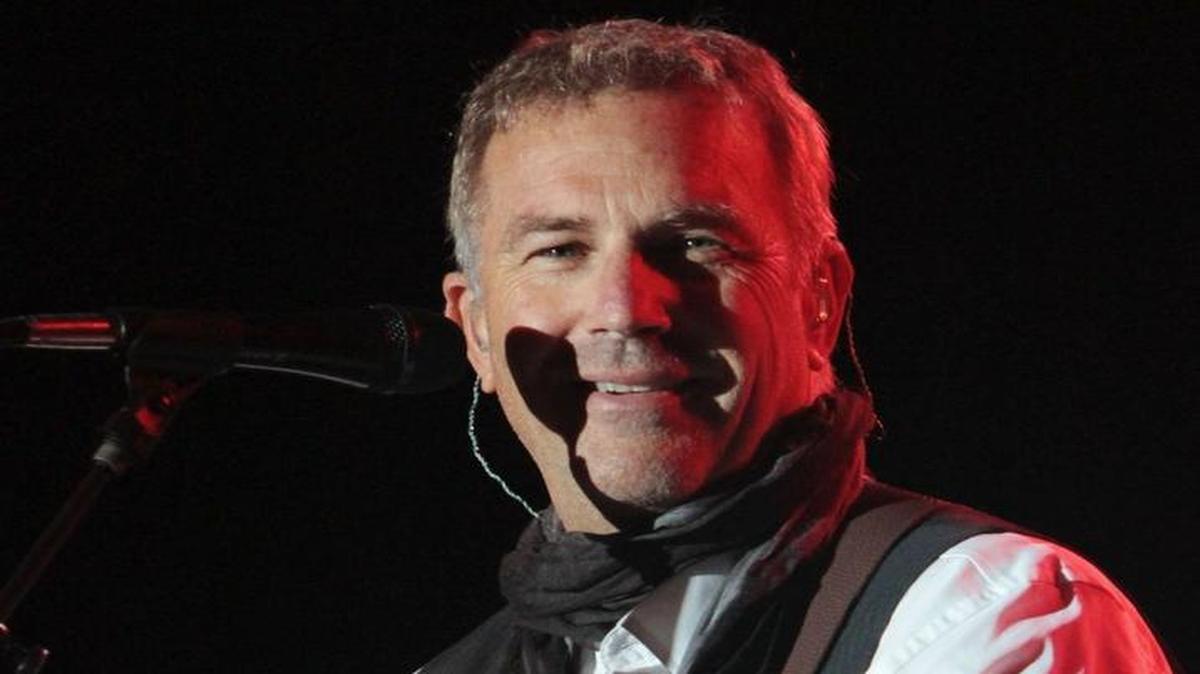 Kevin Costner plays with his band Modern West during the Sun & Sand Film & Music Festival concerts at Jones Park in Gulfport on Saturday Nov. 10, 2012. Costner will be at the Brownstone Center for the Arts on Friday.