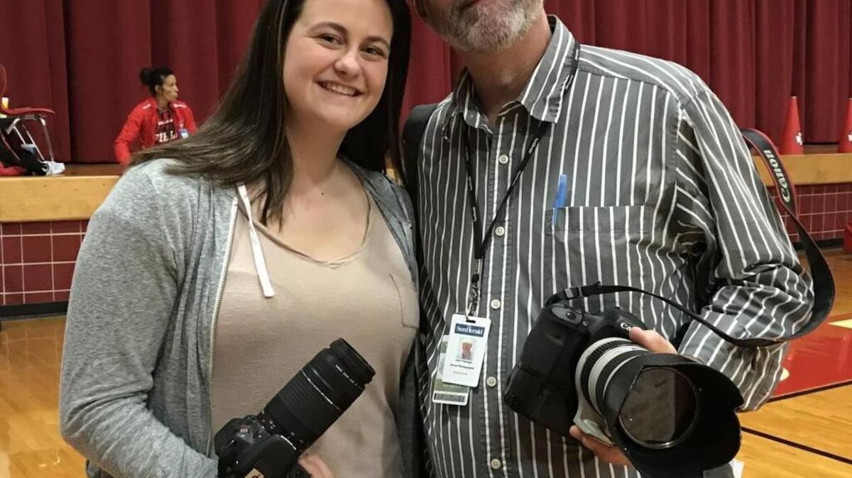 Sun Herald photographer John Fitzhugh and his daughter, Rose, at the Gulfport-Biloxi basketball game at Biloxi High School on Friday, Feb. 10, 2017.