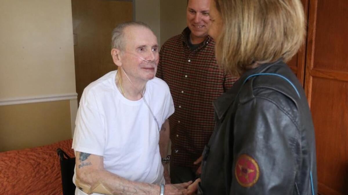 World War II veteran Charles Rogers, left, spent several hours talking with Sun Herald staff writer Anita Lee for a story about his friendship with Biloxi police Patrolman Chris Keckler, right. Lee found Rogers fascinating and he seemed to enjoy meeting her, too.
