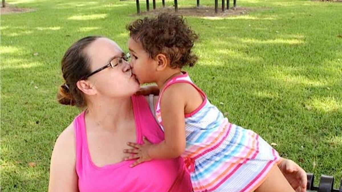 Rita Miller with her daughter, Olivia, 2, in Lighthouse Park, where I met them while working on a story about angel statues anonymously placed around the park. Olivia will never know her older sister, Ma'Leah Grace, who was murdered in August 2013.