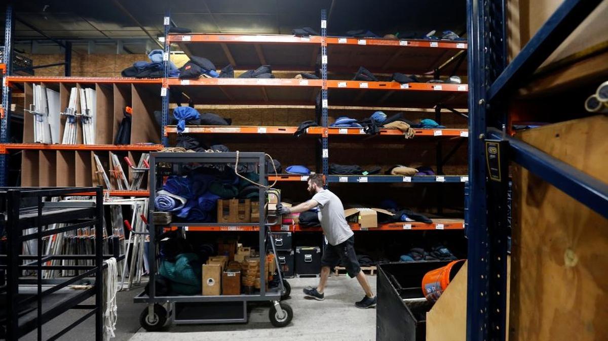In this June 1, 2016 photo, a worker for MBS Equipment Co., a grip and lighting company, moves equipment in their warehouse at Second line Stages, in New Orleans. Louisiana’s once-booming film industry, branded as ‘Hollywood South,’ has gone from darling to Hollywood castoff. The industry is off by as much as 90 percent due to changes to the state’s film tax incentive program that have scared off movie makers
