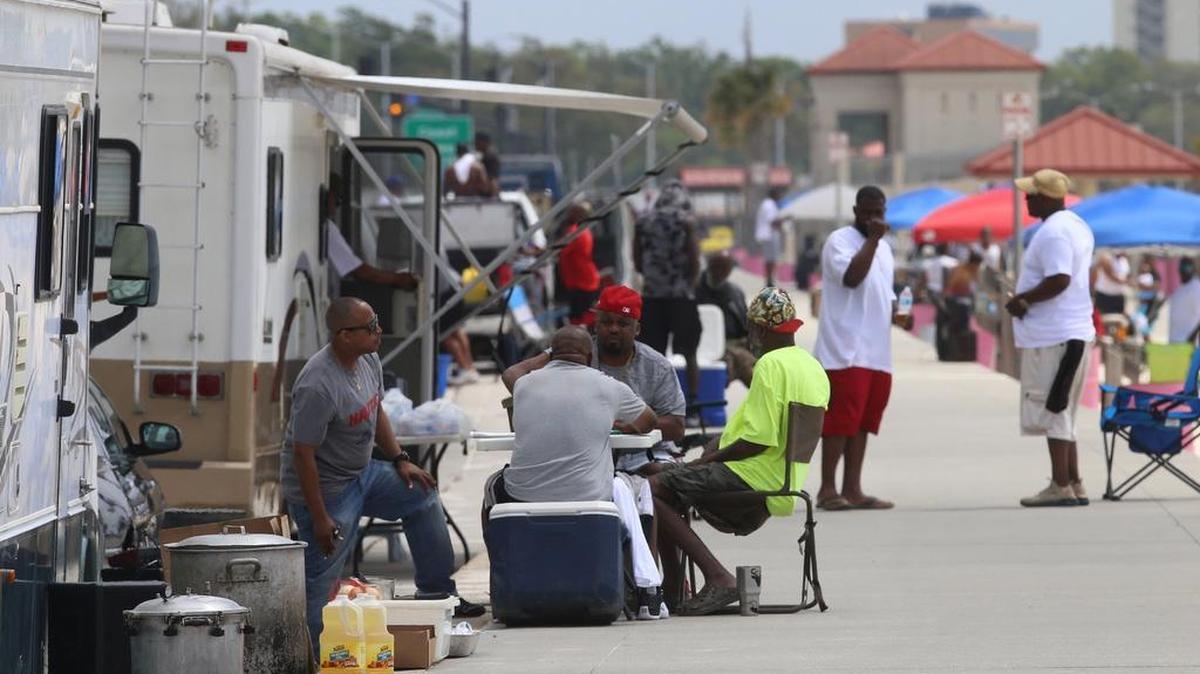 Black Spring Break visitors gather on the boardwalk along U.S. 90 in Biloxi on Friday, April 13, 2018.