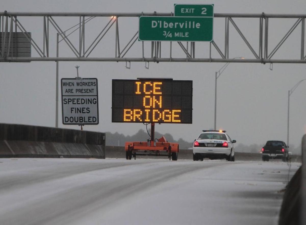 A Biloxi police unit monitors traffic on I-110 in Biloxi on Tuesday Jan. 28, 2014, after a winter storm left ice covering most roads in South Mississippi.