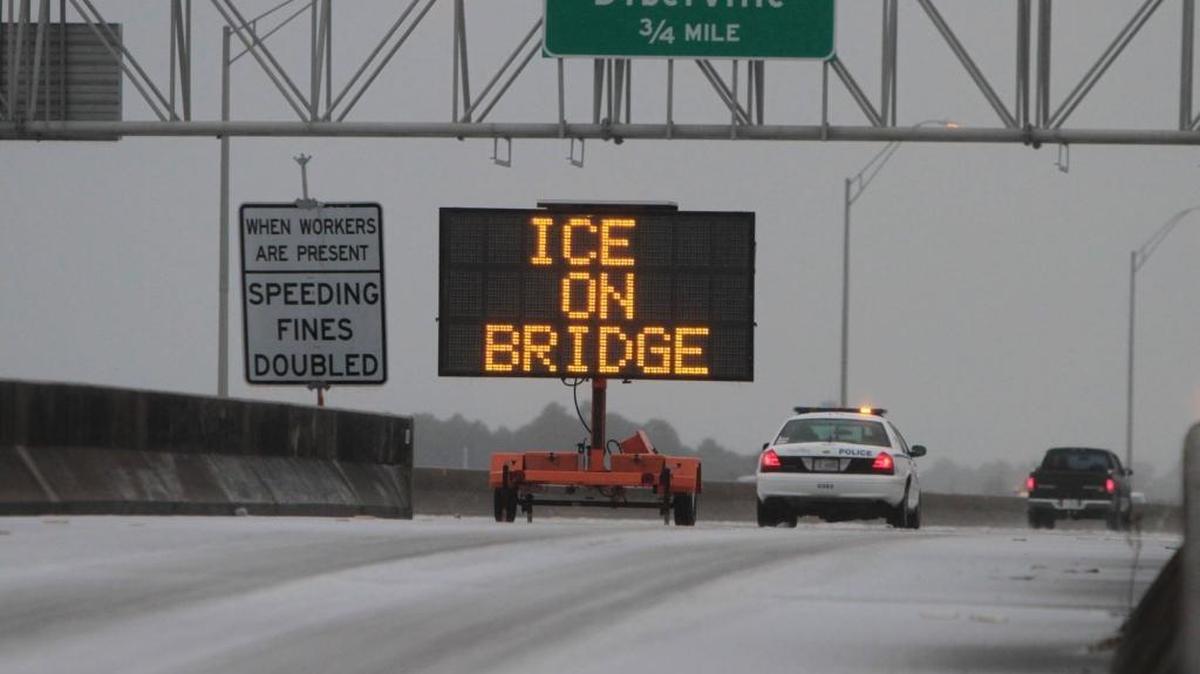 FILE - A Biloxi police unit monitors traffic on I-110 in Biloxi on Tuesday Jan. 28, 2014, after a winter storm left ice covering most roads in South Mississippi. Similar conditions are in this week’s forecast.