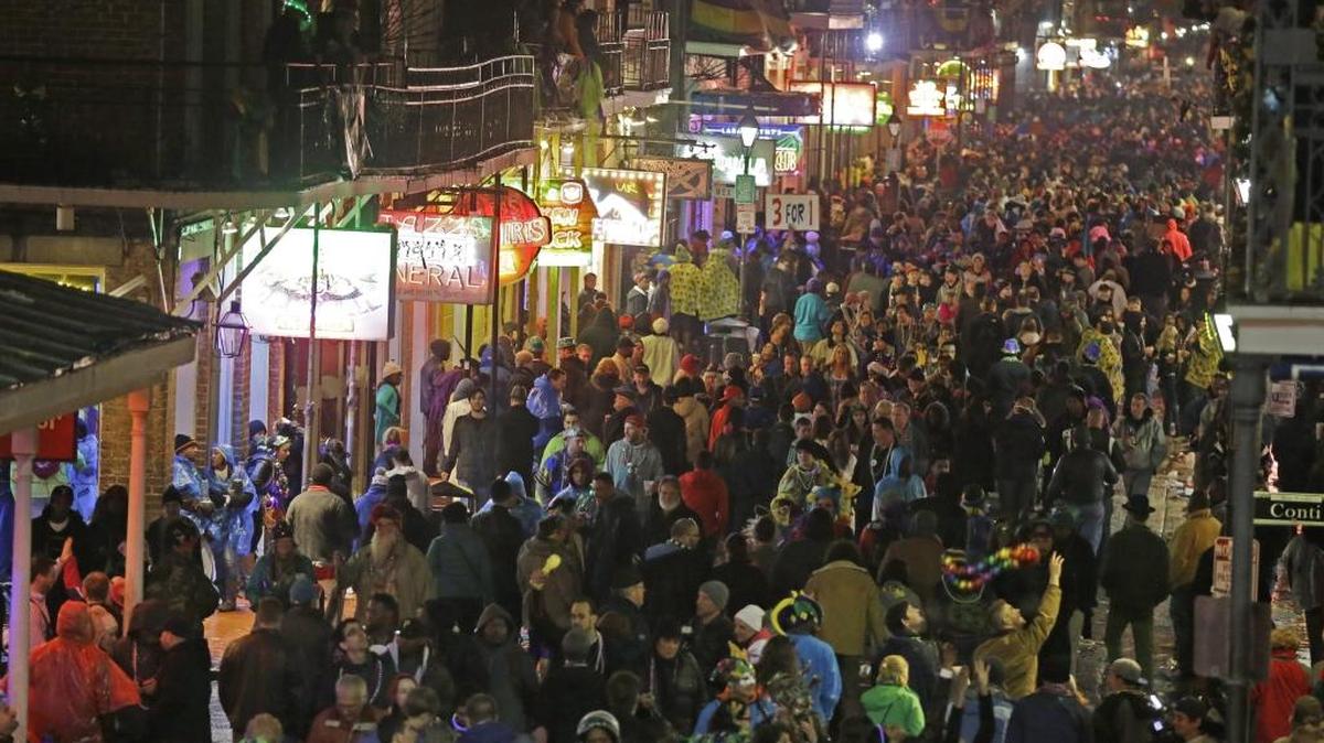 In this March 4, 2014 file, photo, revelers pack the French Quarter during Mardi Gras, as seen from the balcony of the Royal Sonesta Hotel in New Orleans. Mardi Gras falls on Feb. 17 this year.