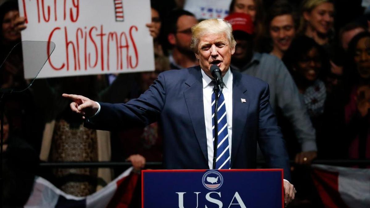 President-elect Donald Trump speaks to supporters about saying Merry Christmas during a rally, in Grand Rapids, Mich., Friday, Dec. 9, 2016.