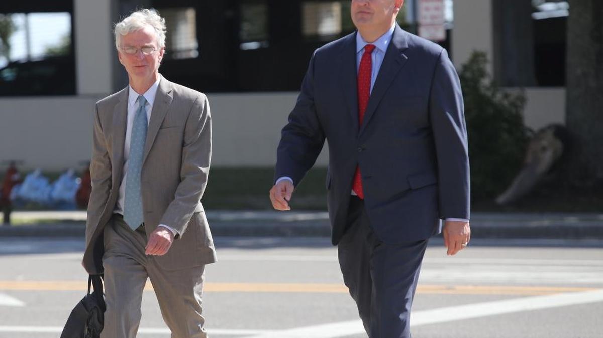 San Antonio attorney Mikal Watts, right, arrives at federal court in Gulfport for an October court appearance. Watts is pictured with Robert McDuff, a prominent and well-regarded criminal-defense attorney from Jackson.