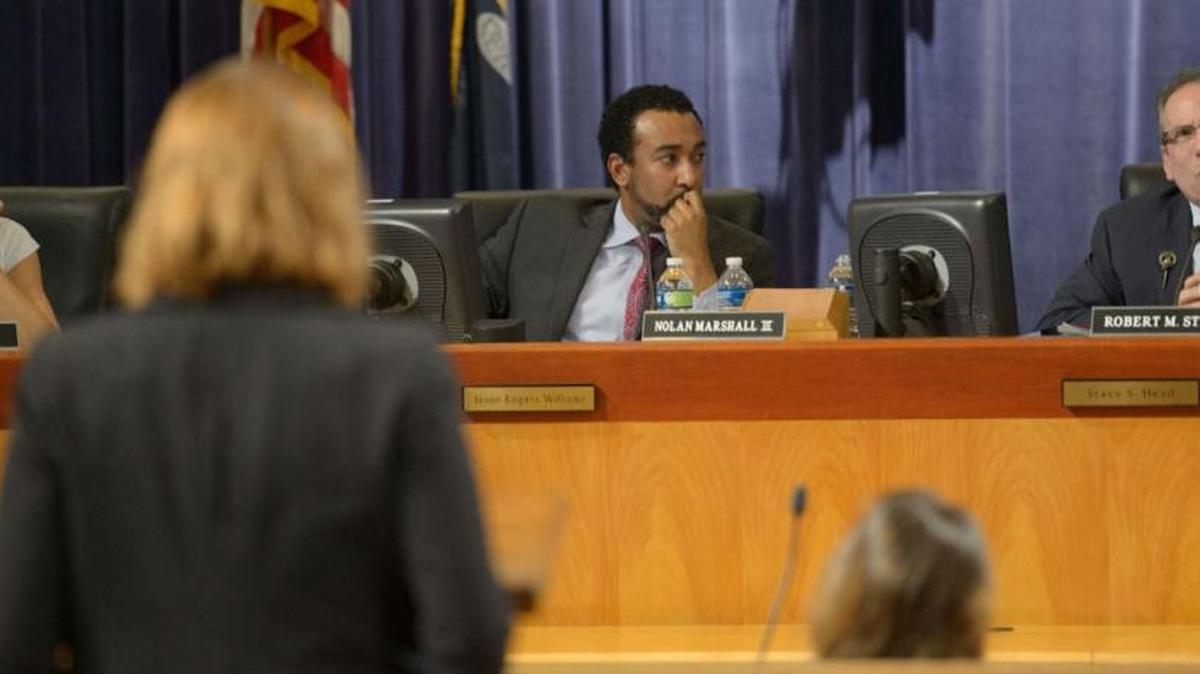 Former Councilwoman Kristin Gisleson Palmer, center, last year urged members of the City Planning Commission to go a step further in regulating strip clubs by saying no one under age 21 should work in an adult entertainment venue.