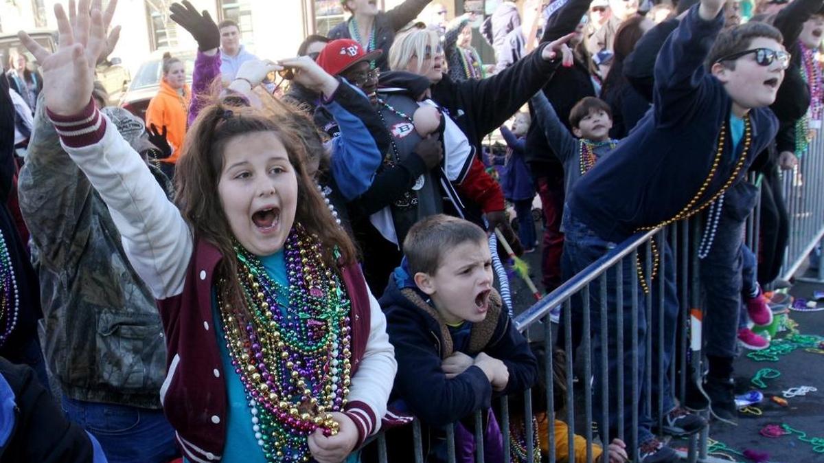Children call for throws during the Gulf Coast Carnival Association Mardi Gras Parade in Biloxi on Feb. 8, 2016. Police advise taking an unfiltered photograph of your children before big events in case they get lost.