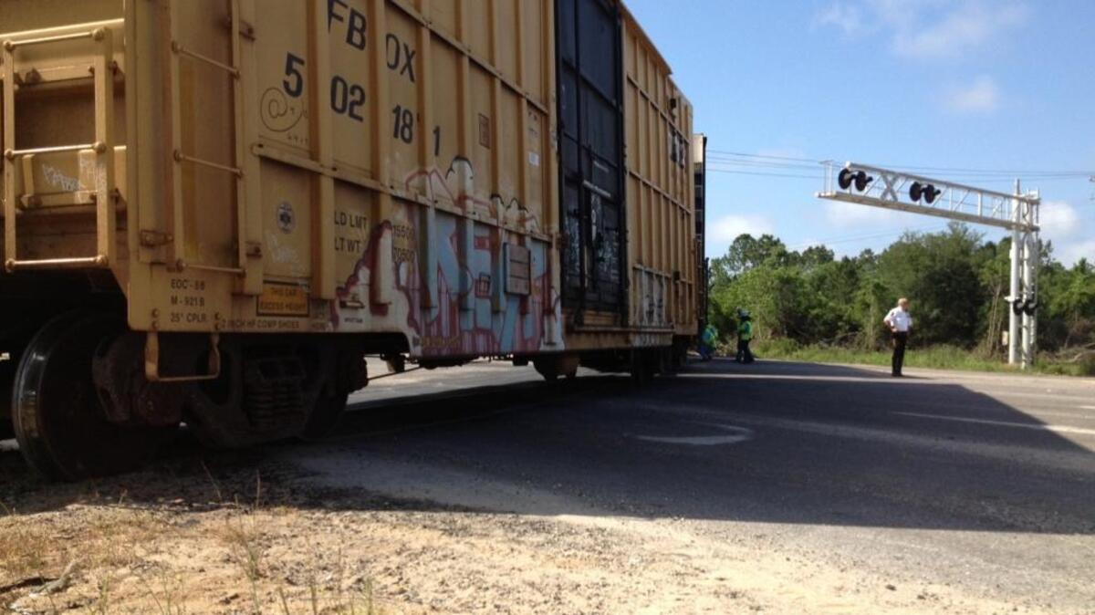 CSX railroad employees work on putting a train back on the tracks after it derailed during work on the side tracks in Pascagoula on Monday morning. The derailment occurred at U.S. 90 and Industrial Road, causing traffic to be re-routed in that area. The Sun Herald chronicled the danger of railroad crossings on the Coast in a 1995 series.