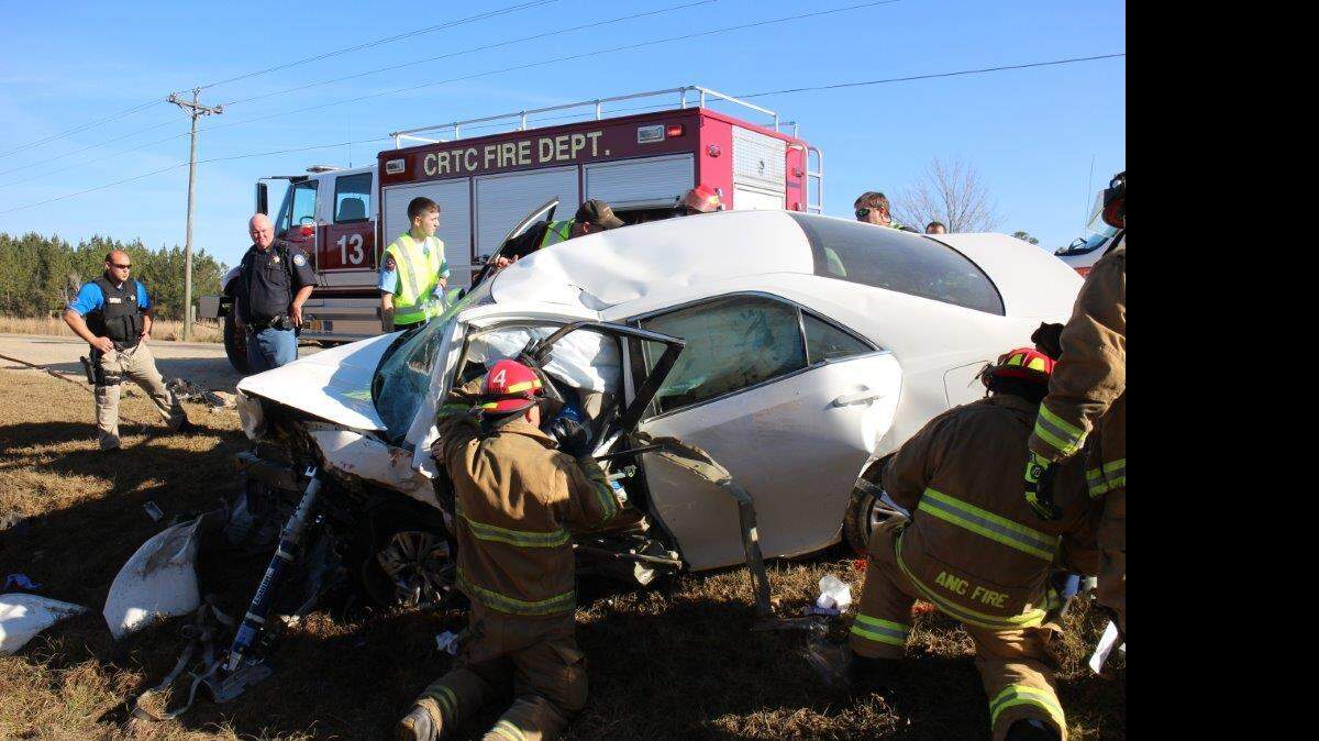 Firefighters from the Harrison County Fire service and the CRTC (airport fire) along with medics from American Medical Response, extricate and treat one of two people who were involved in the 7:45am accident. One person was pronounced dead on the scene and the one was taken to Memorial Hospital at Gulfport.