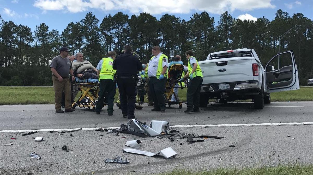 Two people were injured in a second wreck in the eastbound lanes of Interstate 10 on Wednesday, including a Ford Expedition from Jackson County Emergency Services. Earl Etheridge, emergency services director, is shown on a gurney to the left. The wreck was not far from a multiple vehicle wreck earlier in morning that claimed four lives and shut down all westbound lanes.