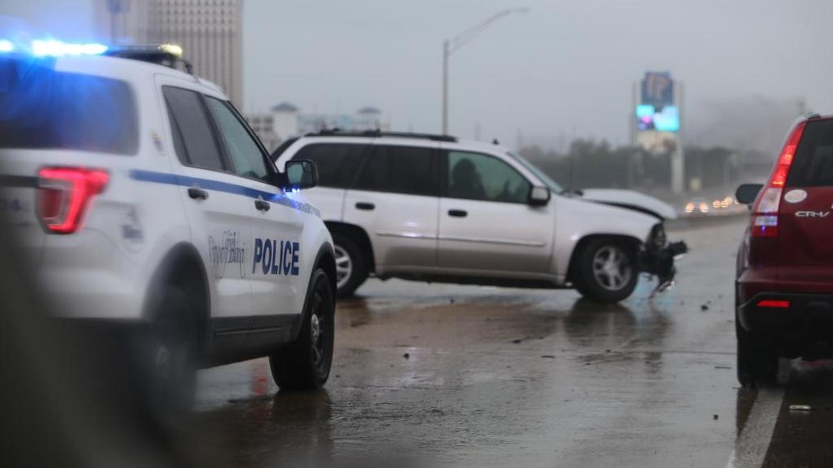 Biloxi police divert traffic after a single-vehicle accident involving a silver SUV on Interstate 110 Sunday morning.