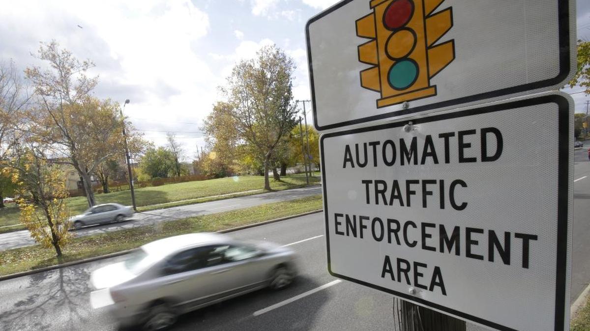 Motorists drive past a sign warning of upcoming traffic cameras in Cleveland, Ohio, where the Supreme Court upheld the use of the cameras in 2014. Mississippi banned their use in 2009.