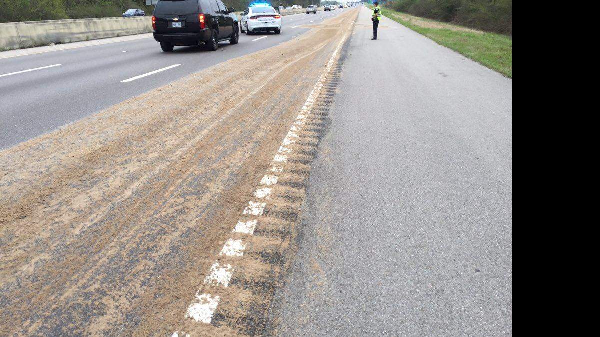 The Mississippi Department of Transportation is at the scene of a hydraulic fuel spill on I-10, spreading dirt to absorb the fluid.