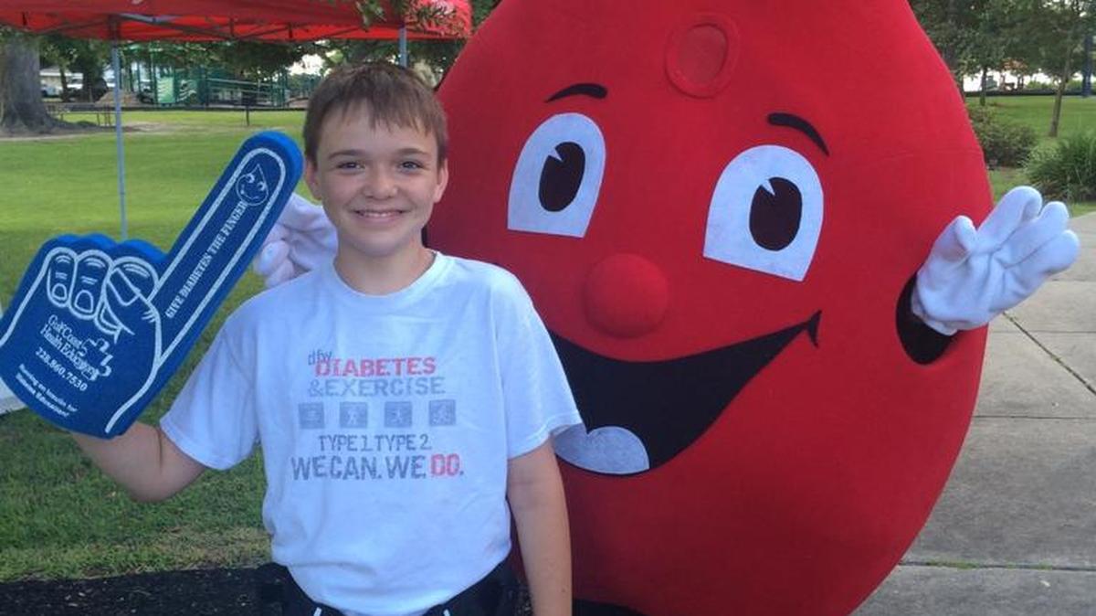 Bryce Deano poses with a blood drop mascot at a past Gulf Coast Health Educators Diabetes 5K Fun Run in Pass Christian. The diabetes walk will honor Deano’s Long Beach family.
